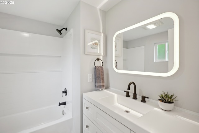 bathroom with bathing tub / shower combination and vanity