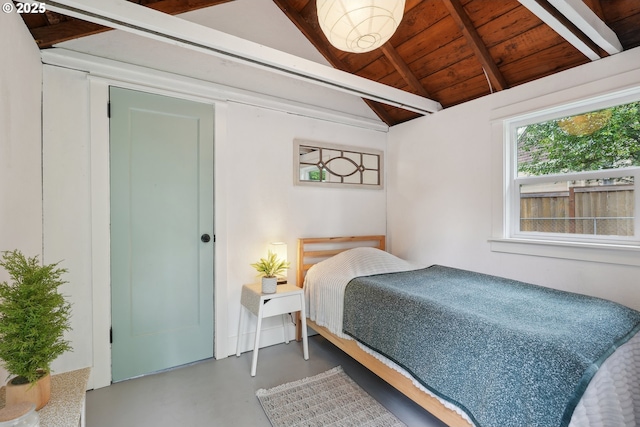 bedroom featuring concrete floors and wood ceiling