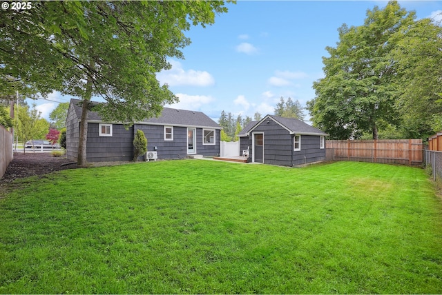 back of property with an outdoor structure and a patio