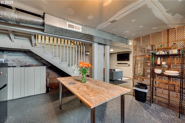 dining space with visible vents and stairs
