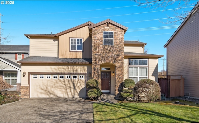 view of front of property featuring driveway, a garage, stone siding, board and batten siding, and a front yard