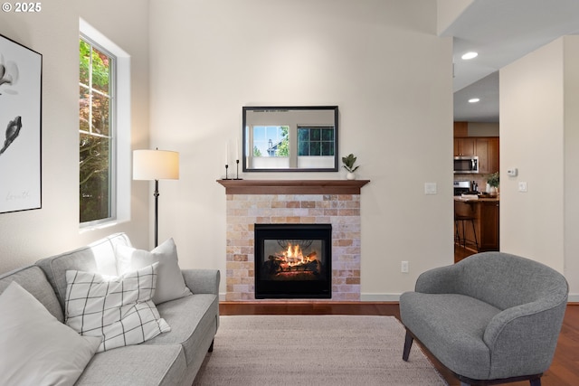 29229 SW Costa Cir E, Wilsonville, OR 97070 - living room featuring wood finished floors, recessed lighting, a fireplace, and baseboards