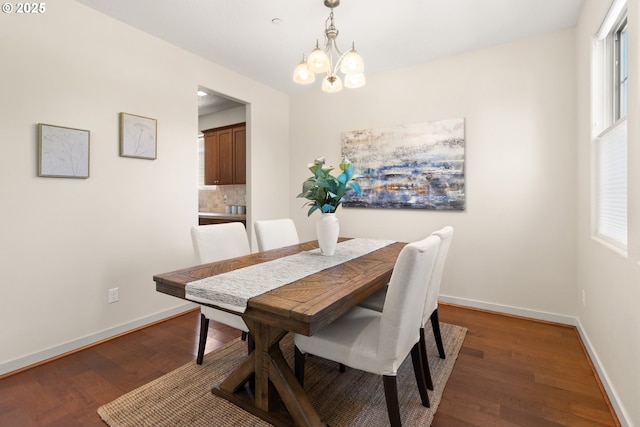 29229 SW Costa Cir E, Wilsonville, OR 97070 - dining space with baseboards, wood finished floors, and a chandelier