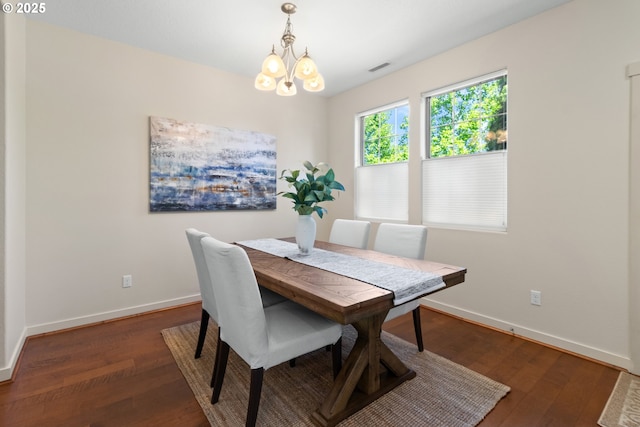 29229 SW Costa Cir E, Wilsonville, OR 97070 - dining space featuring baseboards, a chandelier, and wood finished floors