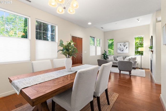 29229 SW Costa Cir E, Wilsonville, OR 97070 - dining area featuring a chandelier, baseboards, wood finished floors, and recessed lighting