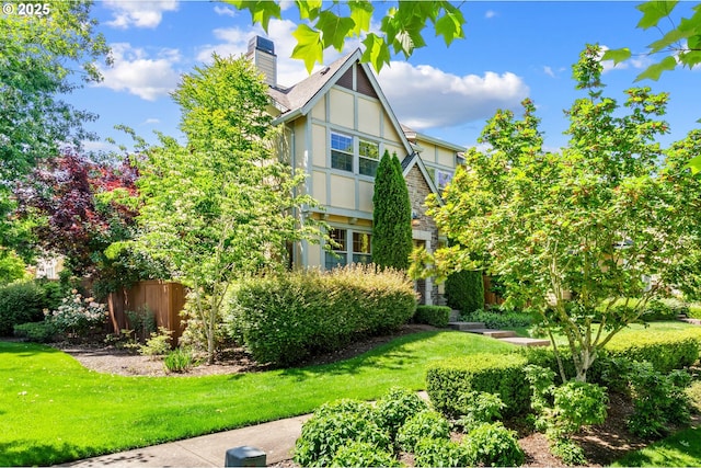 29229 SW Costa Cir E, Wilsonville, OR 97070 - rear view of house featuring stucco siding and a chimney