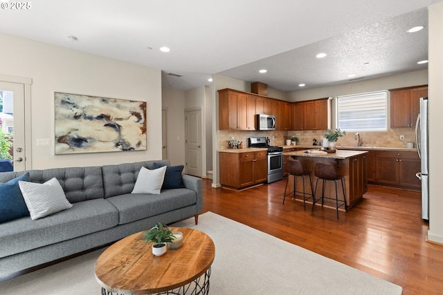 29229 SW Costa Cir E, Wilsonville, OR 97070 - living room featuring dark wood-type flooring and recessed lighting