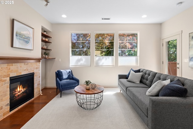 29229 SW Costa Cir E, Wilsonville, OR 97070 - living room with wood finished floors, a fireplace, and recessed lighting