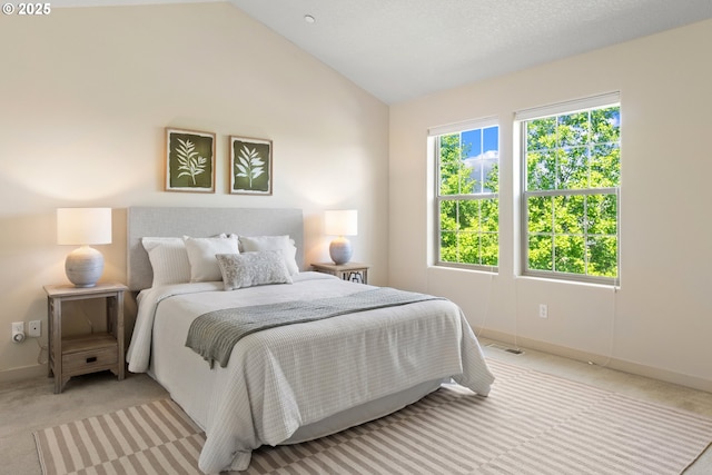 29229 SW Costa Cir E, Wilsonville, OR 97070 - bedroom featuring light carpet, baseboards, and vaulted ceiling