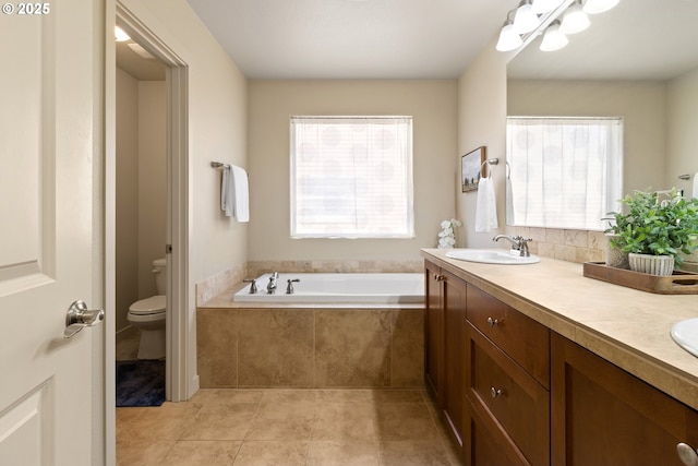 29229 SW Costa Cir E, Wilsonville, OR 97070 - bathroom featuring toilet, a garden tub, double vanity, and tile patterned floors