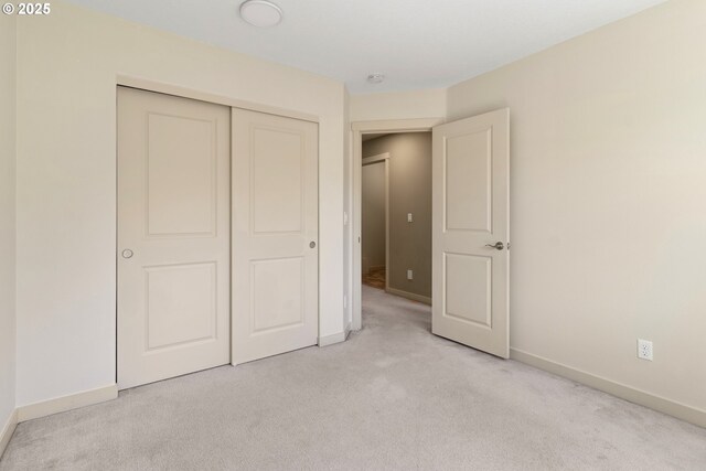 29229 SW Costa Cir E, Wilsonville, OR 97070 - unfurnished bedroom with light colored carpet, baseboards, and a closet