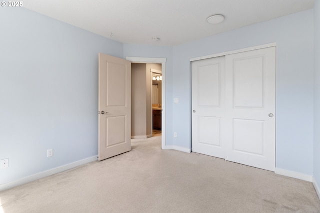 29229 SW Costa Cir E, Wilsonville, OR 97070 - unfurnished bedroom featuring light carpet, baseboards, and a closet