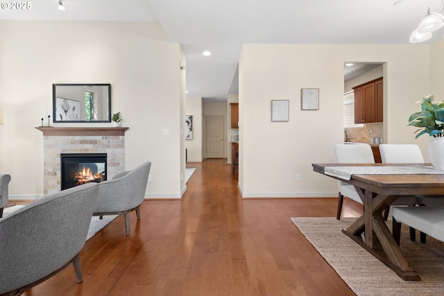 29229 SW Costa Cir E, Wilsonville, OR 97070 - living area featuring wood finished floors, a multi sided fireplace, baseboards, and recessed lighting