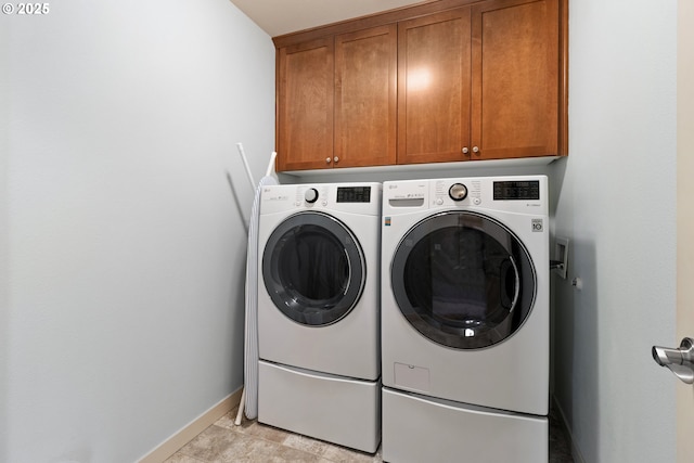 29229 SW Costa Cir E, Wilsonville, OR 97070 - washroom with cabinet space, washer and dryer, and baseboards
