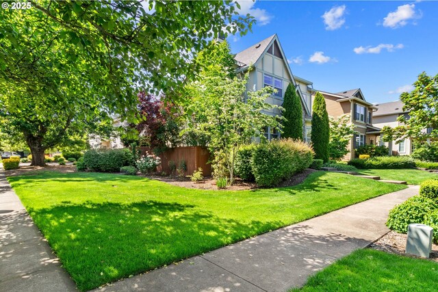 29229 SW Costa Cir E, Wilsonville, OR 97070 - view of side of home with a lawn
