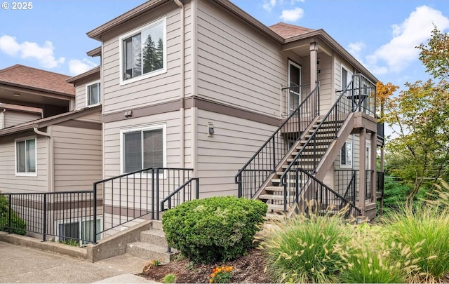 view of side of property with stairs