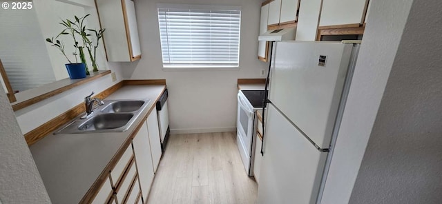 kitchen featuring white appliances, light wood finished floors, custom exhaust hood, a sink, and white cabinetry