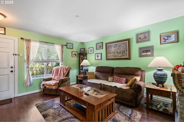 living area with wood finished floors and baseboards