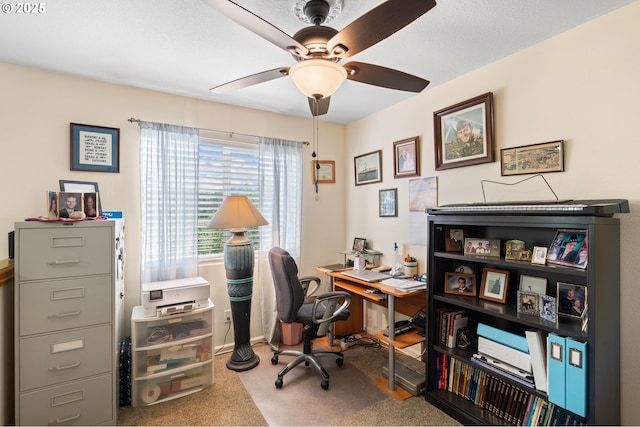 home office featuring ceiling fan, carpet floors, and baseboards