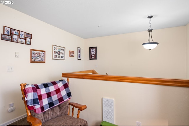 sitting room featuring baseboards