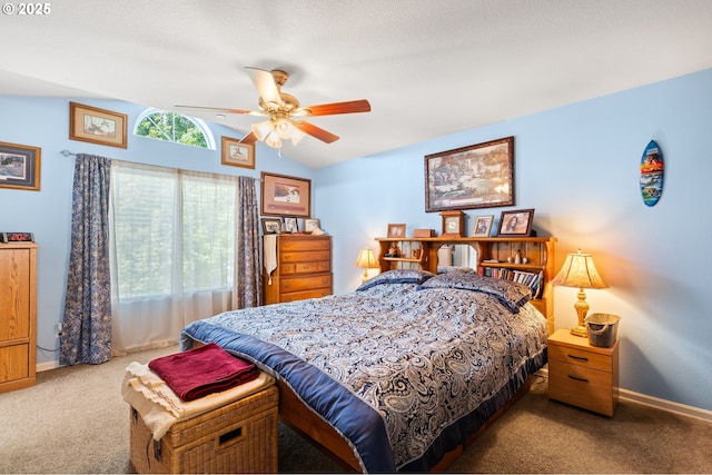 bedroom with carpet, lofted ceiling, baseboards, and a ceiling fan