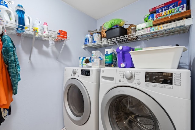 clothes washing area featuring washing machine and dryer