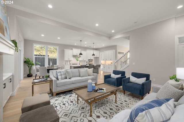 4998 NW Deerhaven Ter, Portland, OR 97229 - living room featuring stairs, recessed lighting, light wood finished floors, crown molding, and baseboards