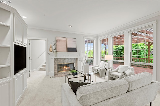 1206 NW Mayfield Rd, Portland, OR 97229 - living area with light carpet, a high end fireplace, ornamental molding, recessed lighting, and stairs