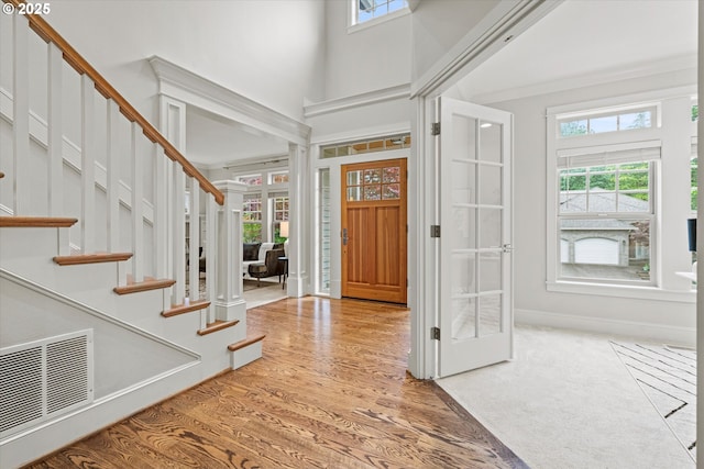 1206 NW Mayfield Rd, Portland, OR 97229 - foyer entrance featuring healthy amount of natural light, french doors, stairway, wood finished floors, and a high ceiling