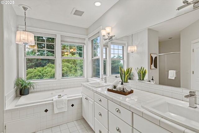 1206 NW Mayfield Rd, Portland, OR 97229 - full bath featuring double vanity, a chandelier, a garden tub, tile patterned floors, and recessed lighting
