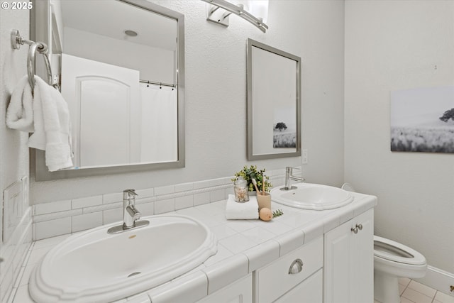 1206 NW Mayfield Rd, Portland, OR 97229 - bathroom featuring double vanity, toilet, and tile patterned flooring