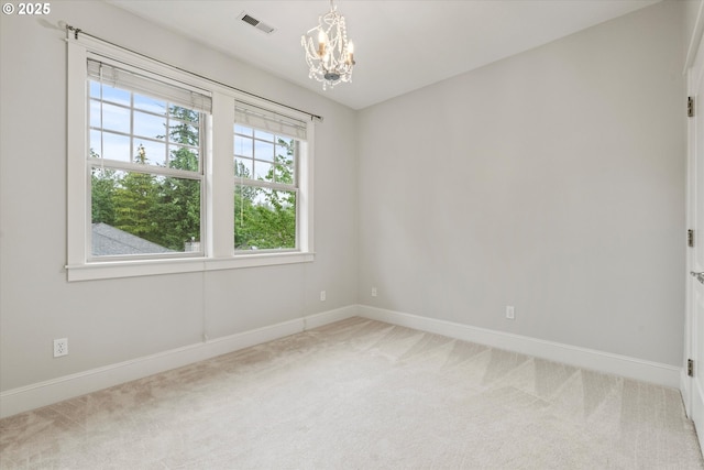 1206 NW Mayfield Rd, Portland, OR 97229 - carpeted empty room with baseboards and a chandelier