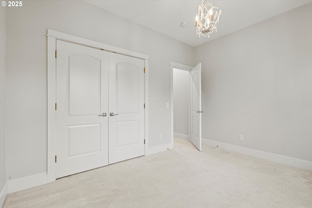 1206 NW Mayfield Rd, Portland, OR 97229 - unfurnished bedroom with carpet, a chandelier, baseboards, and a closet