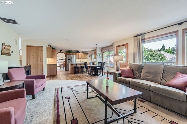 5839 NW Necanicum Way, Portland, OR 97229 - living area with light wood finished floors and recessed lighting