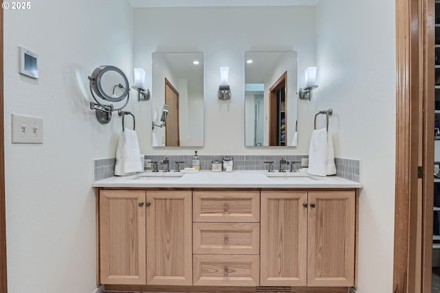 5839 NW Necanicum Way, Portland, OR 97229 - bathroom with double vanity and backsplash