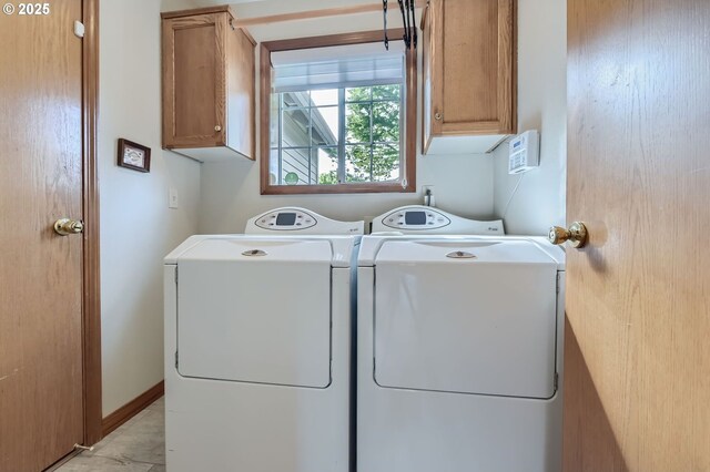 5839 NW Necanicum Way, Portland, OR 97229 - laundry room with cabinet space and washer and dryer