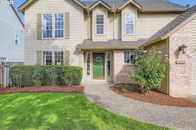 5839 NW Necanicum Way, Portland, OR 97229 - view of front of house featuring brick siding and roof with shingles