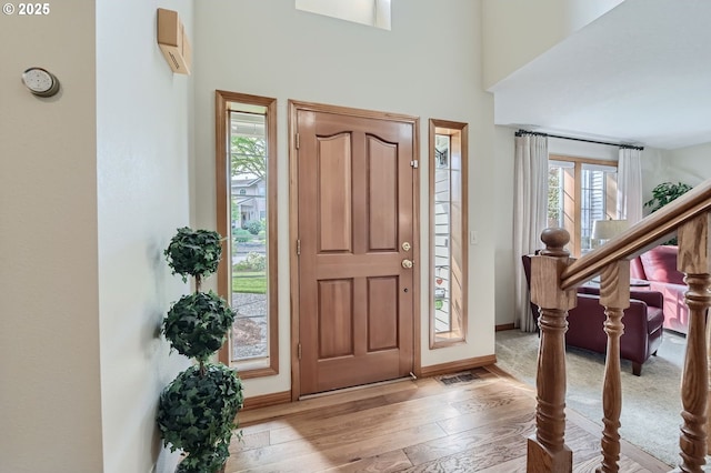 5839 NW Necanicum Way, Portland, OR 97229 - foyer featuring wood finished floors and a high ceiling