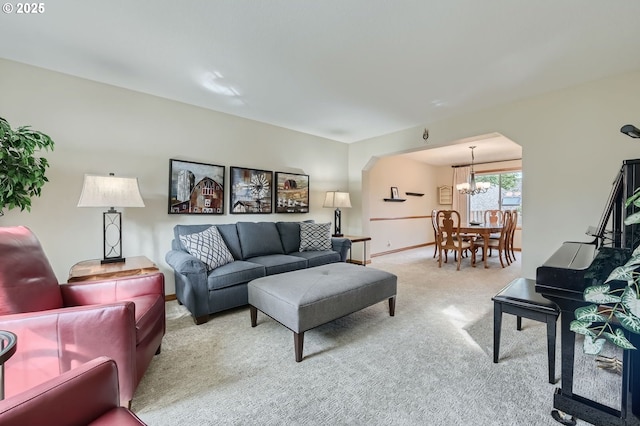 5839 NW Necanicum Way, Portland, OR 97229 - living room with arched walkways, light carpet, and a chandelier