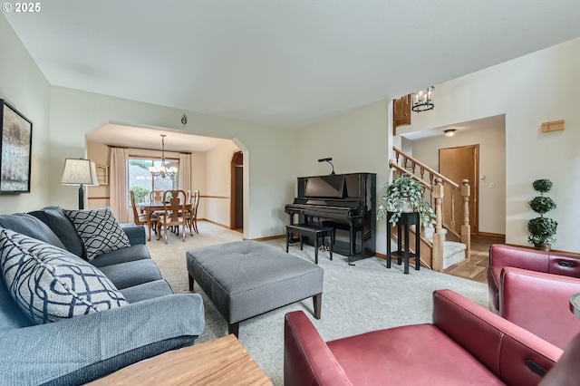 5839 NW Necanicum Way, Portland, OR 97229 - carpeted living room with a chandelier, arched walkways, and stairs