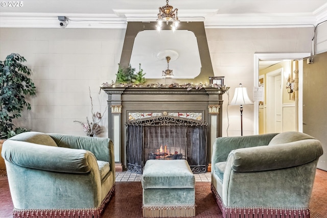 living area with a fireplace with flush hearth and ornamental molding