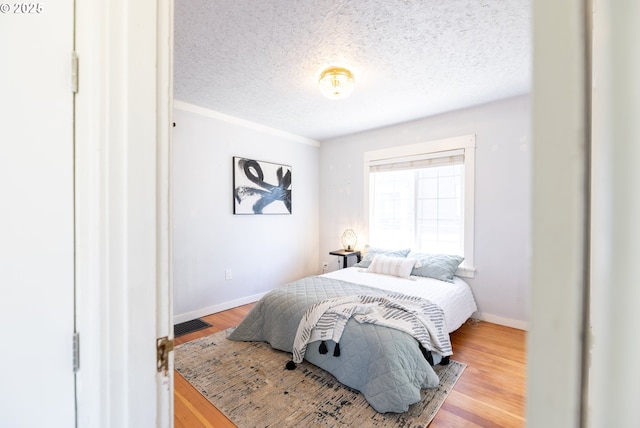 125 NE 80th Ave, Portland, OR 97213 - bedroom with wood finished floors and a textured ceiling
