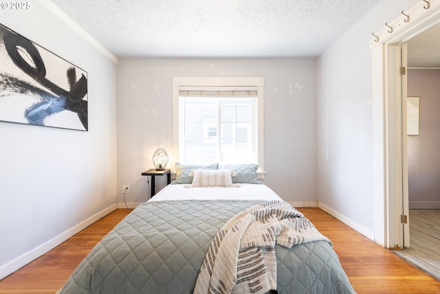 125 NE 80th Ave, Portland, OR 97213 - bedroom featuring a textured ceiling and wood finished floors