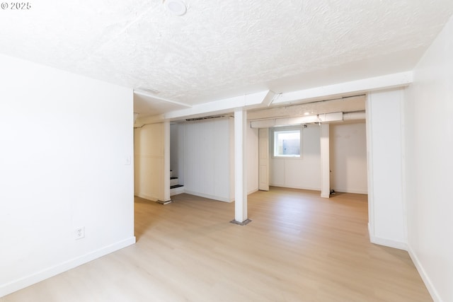 125 NE 80th Ave, Portland, OR 97213 - basement featuring light wood-style floors and a textured ceiling