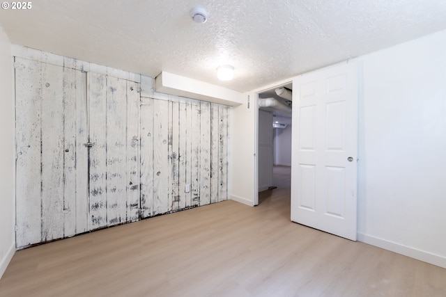 125 NE 80th Ave, Portland, OR 97213 - finished below grade area featuring wood finished floors and a textured ceiling