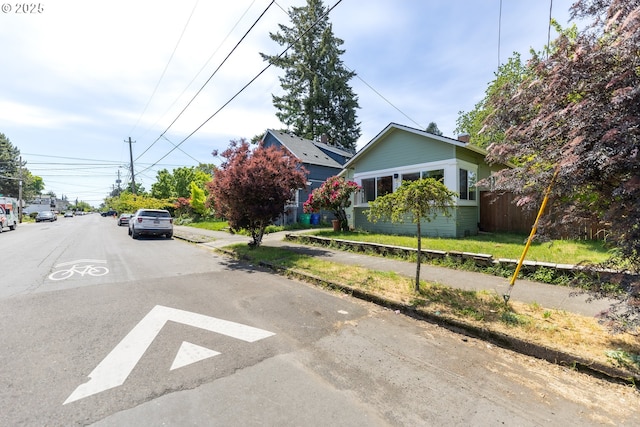 125 NE 80th Ave, Portland, OR 97213 - view of asphalt road with sidewalks and curbs
