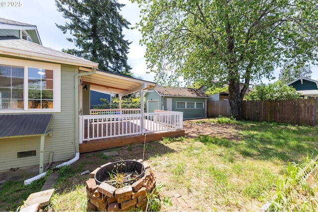 125 NE 80th Ave, Portland, OR 97213 - view of yard with a wooden deck, an outdoor structure, and a fire pit