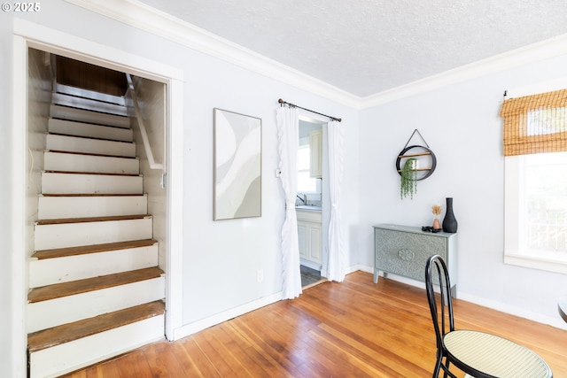 125 NE 80th Ave, Portland, OR 97213 - staircase with ornamental molding, wood finished floors, and a textured ceiling