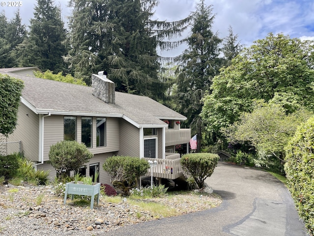 755 17th Ave, Coos Bay, OR 97420 - view of front of property with a chimney and roof with shingles