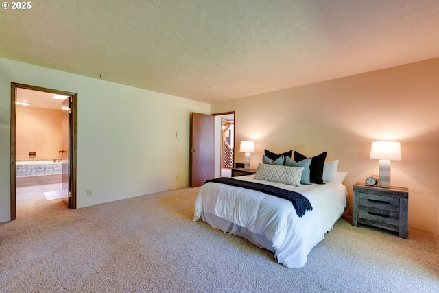 carpeted bedroom featuring a textured ceiling and connected bathroom